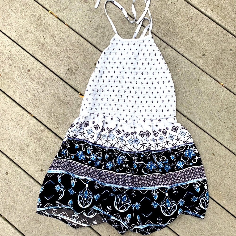 Bohemian romper halter style with cross strap in back. Size small